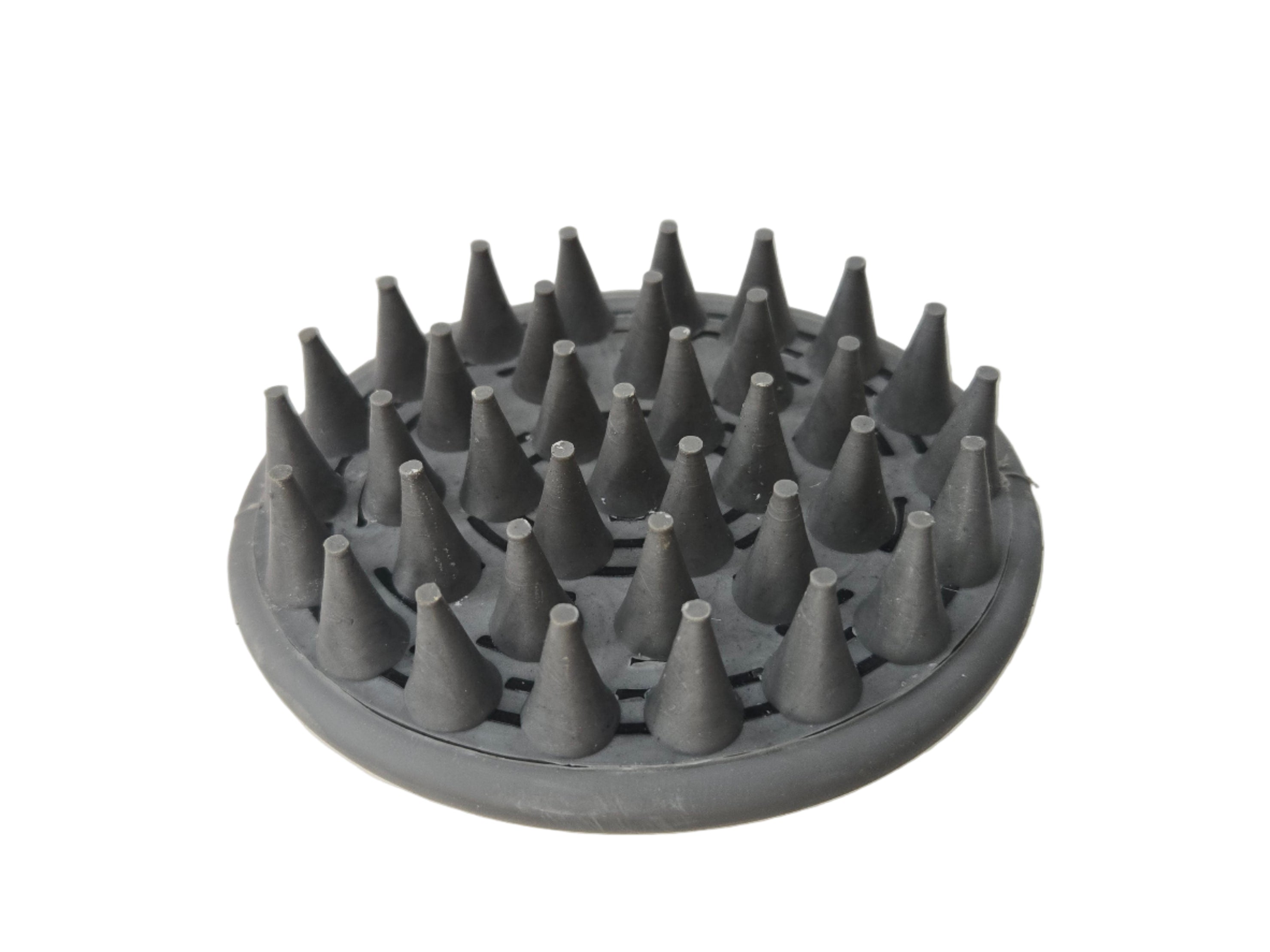 Gray grooming brush with spiked surface on a white background